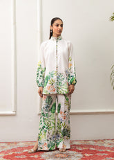 A woman modeling a floral print co-ord set with a mandarin collar and flared trousers.
LaRosa Summer Dreams Delia white cotton loungewear set for women.